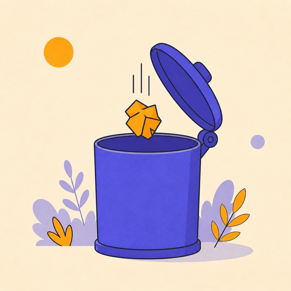 A crumpled paper wrapper falling into an open dustbin.